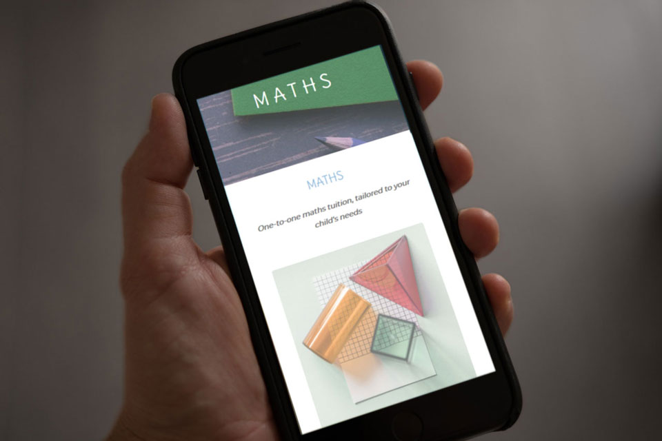 Maths tuition website shown on a mobile phone